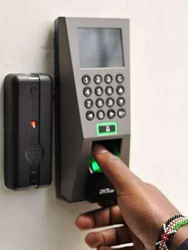Fingerprint and keypad access control reader on a wall
